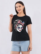 Woman wearing a black t-shirt with a graphic design of a woman's face with an American flag headband and sunglasses on a white background.
