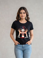 Woman wearing a black t-shirt with a graphic design and text, standing against a plain background.