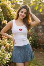 Woman wearing a CherryPop red lips hand-beaded cotton rib tank top with a fitted sleeveless silhouette.