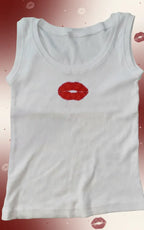 Woman wearing a CherryPop red lips hand-beaded cotton rib tank top with a fitted sleeveless silhouette.