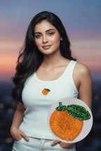 Women's white cotton ribbed tank top featuring a handcrafted orange blossom beaded motif by CherryPop.
