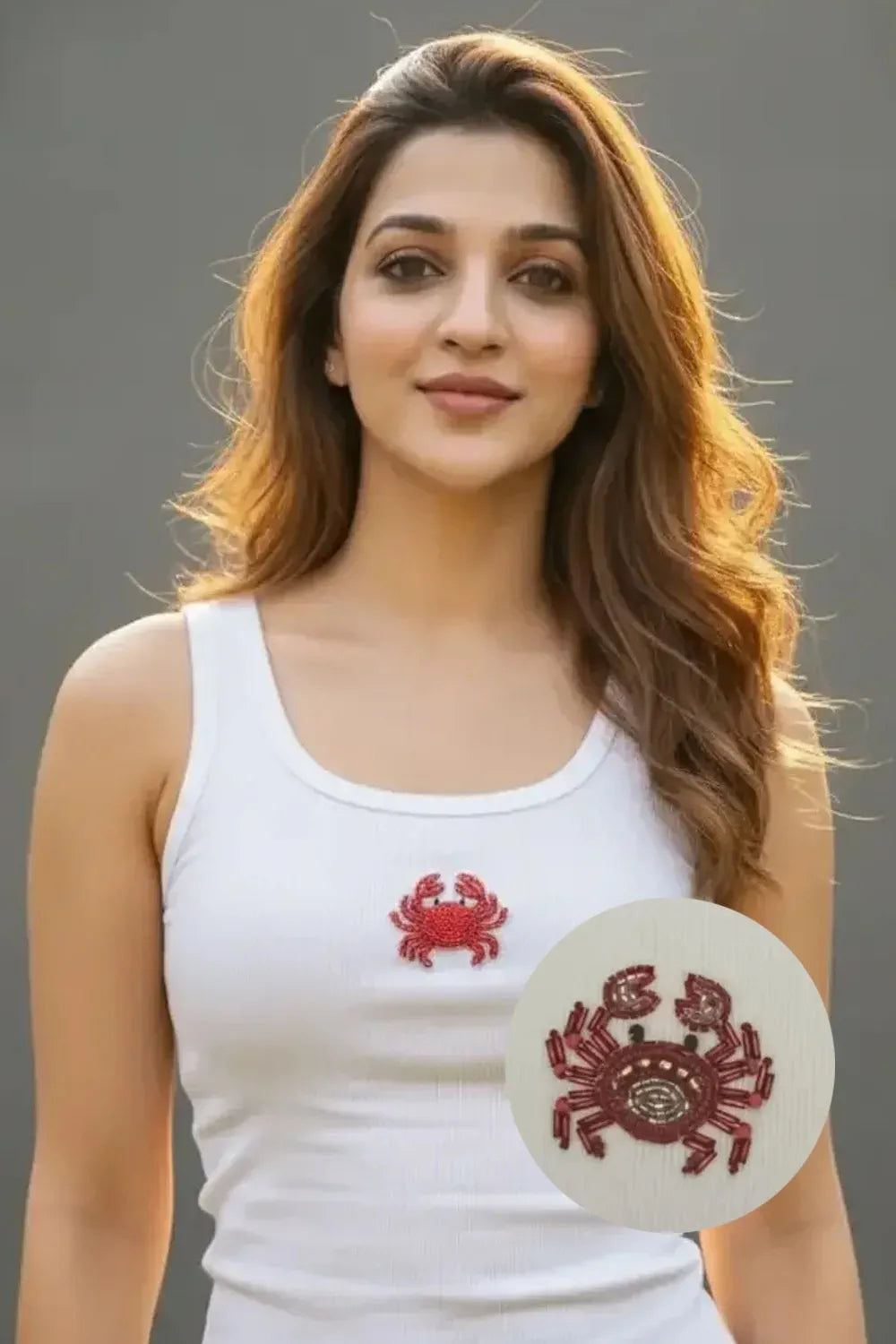 Women's white cotton ribbed tank top featuring a handcrafted crab beadwork motif by CherryPop.
